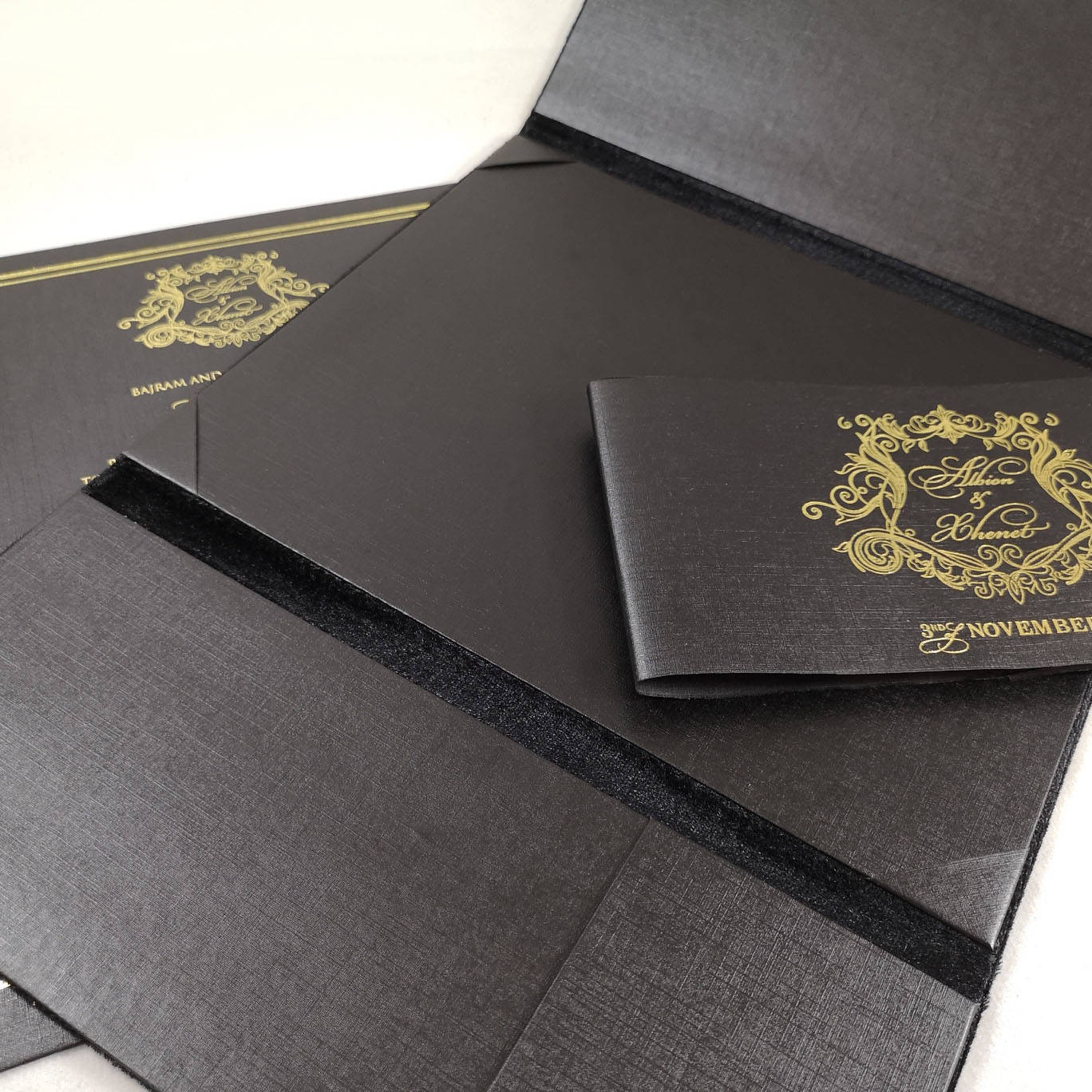 Elegant wedding invitation design with gold foil stamped monogram
