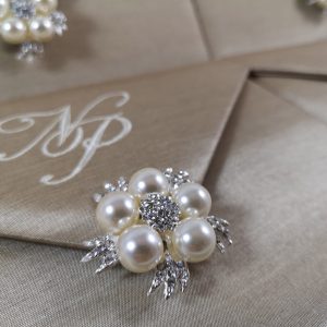 Elegant pearl brooch invitation envelope
