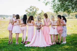 Bride with bridesmaids during micro wedding ceremony