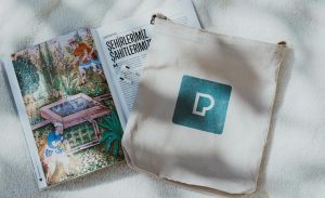 Silk-screen printed cotton tote bag in clients corporate identity