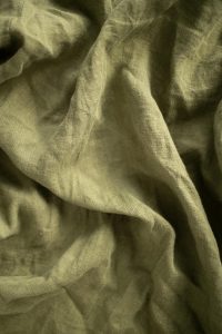 Linen fabric, green color, used for luxury eco-friendly invitations