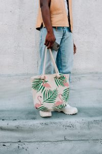 men carrying his custom printed, medium sized flamingo pattern tote bag