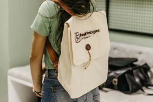 Canvas backpack with custom embroidery of a business
