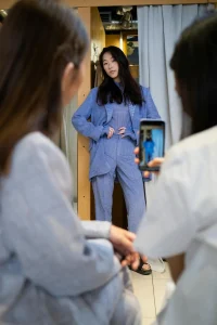Party guest take picture of celebrity backstage