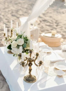 Beach wedding table decoration featuring top stand chandelier