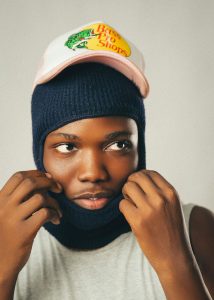 Rapper wearing custom designed baseball hat from Thailand